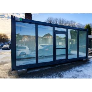 Modern portable cabin office with large glass windows and sleek design