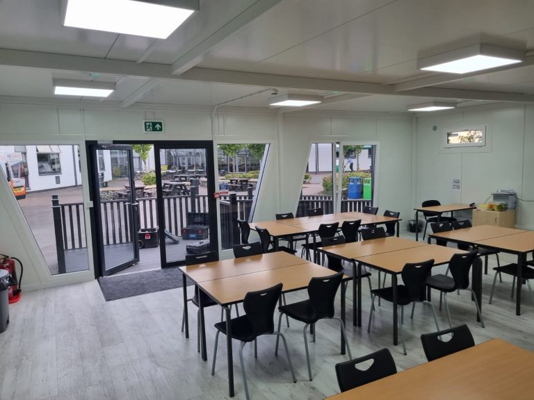 Completed modular building on a UK site with external finish and access area