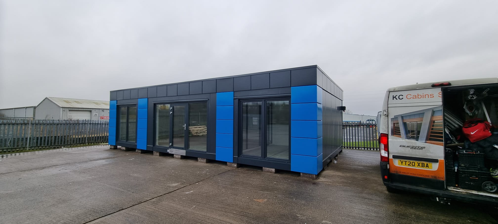 Bespoke modular buildings UK - blue and grey commercial office building with modern cladding and aluminium windows by KC Modular Buildings