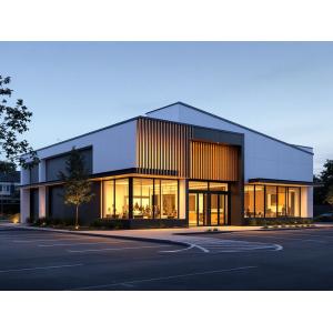 Modern bespoke modular building with vertical timber slats and floor-to-ceiling windows, featuring energy-efficient design and architectural lighting by KC Modular Buildings