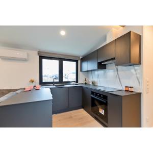 Texel Deluxe Mobile Home modern kitchen featuring premium appliances and triple-glazed windows