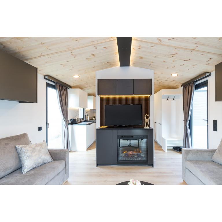 Maldives luxury mobile home with floor-to-ceiling glazing and dual-finish exterior