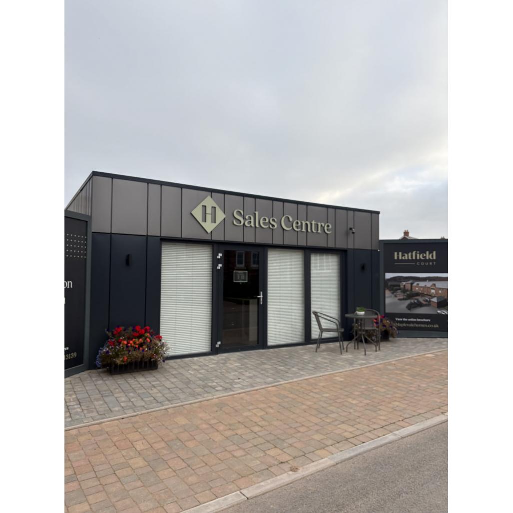 branded-sales-centre-marketing-suite-hatfield-court-kc-modular-buildings.jpg Branded portable sales centre with anthracite grey cladding, illuminated signage and integrated blinds for Hatfield Court development by KC Modular Buildings