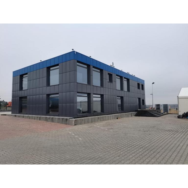 Two-storey ISO Frame modular office building with anthracite grey cladding and blue roof trim by KC Modular Buildings UK