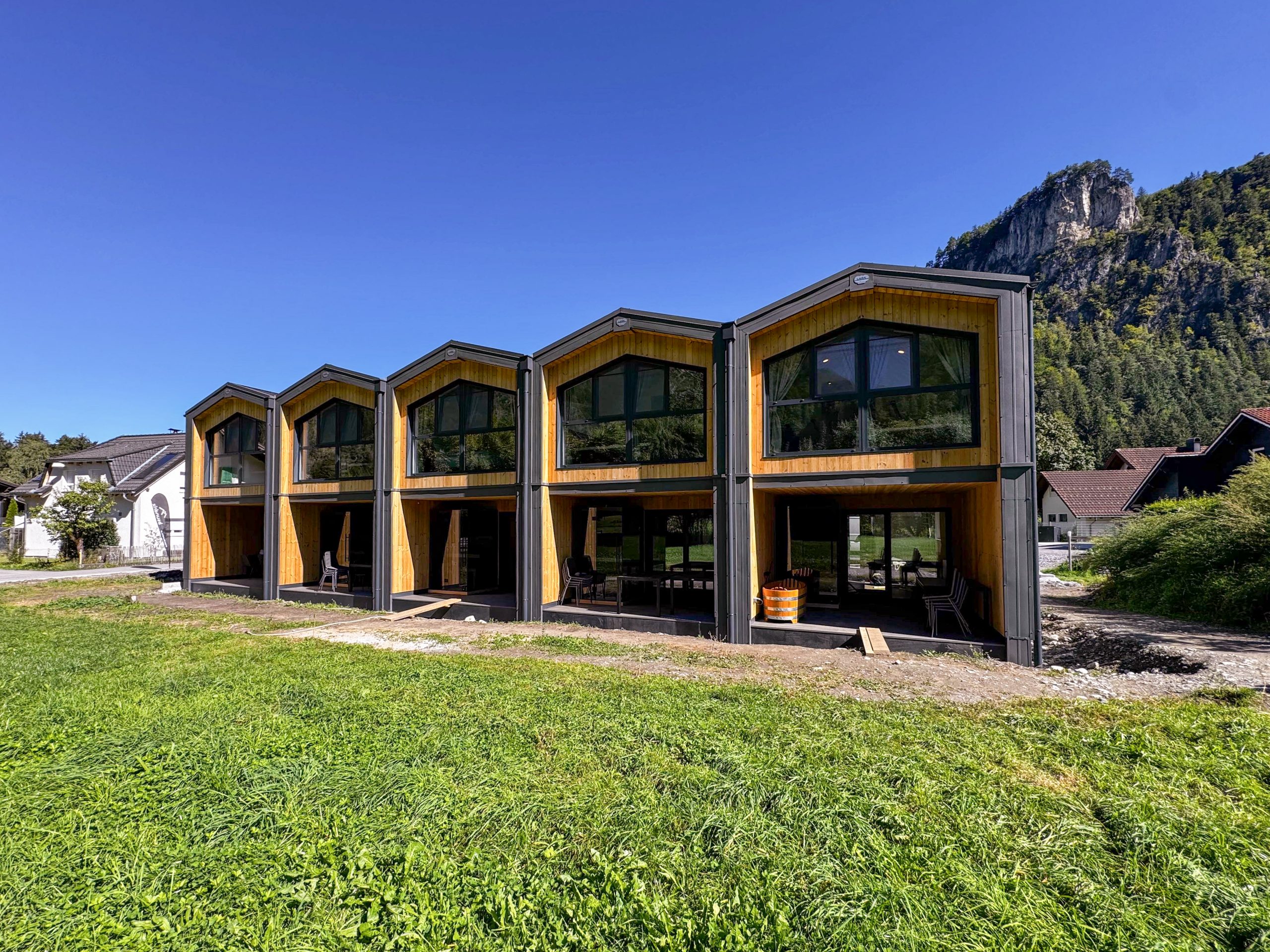 LARK Series premium static lodge with C24 timber frame in alpine setting by KC Modular Buildings