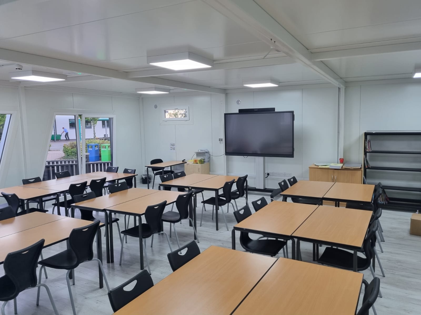Modular classroom installation showing energy-efficient windows and doors
