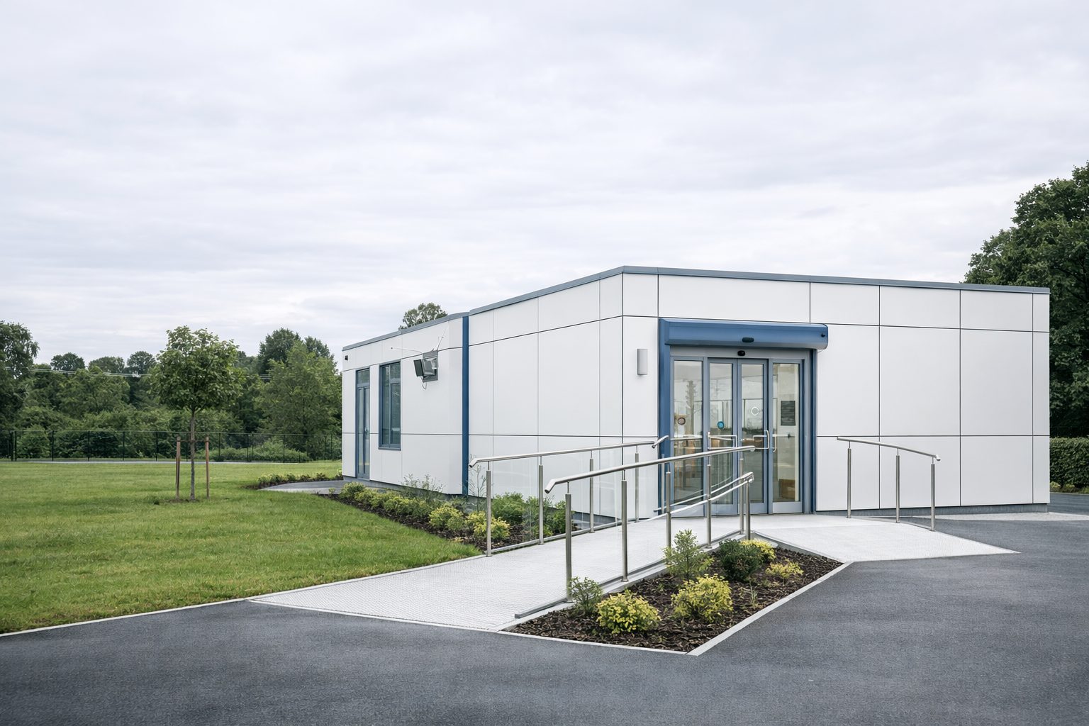 Modern modular medical clinic with accessible entrance, white cladding and NHS-standard facilities