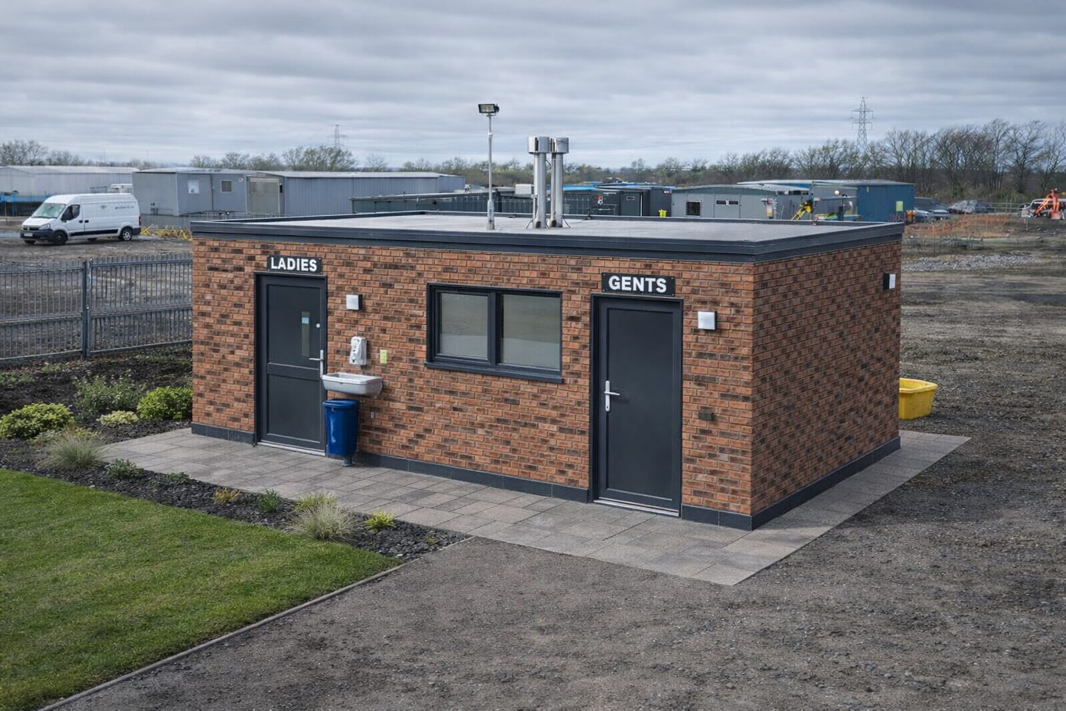 Permanently installed ISO frame modular welfare building with brick slip cladding facade and aluminium windows