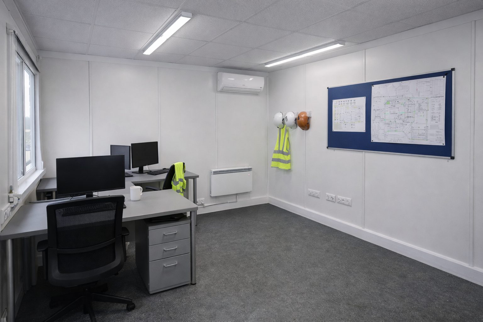 Basic robust interior finish for modular office - white melamine walls, heavy-duty vinyl flooring, LED batten lighting and electric panel heaters