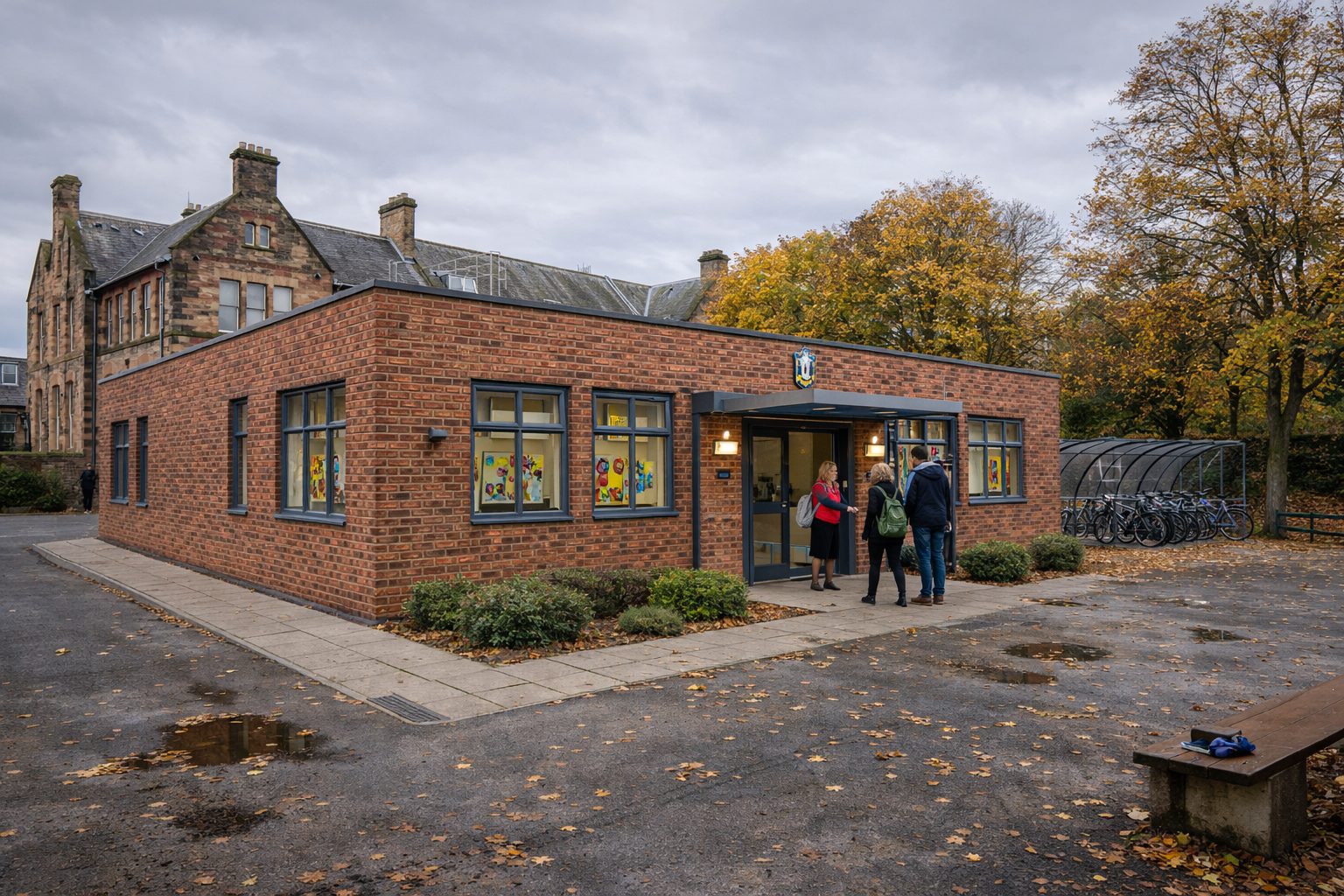 ISO frame permanent modular office building with brick slip facade for Edinburgh school — 75+ year lifespan, Part L compliant