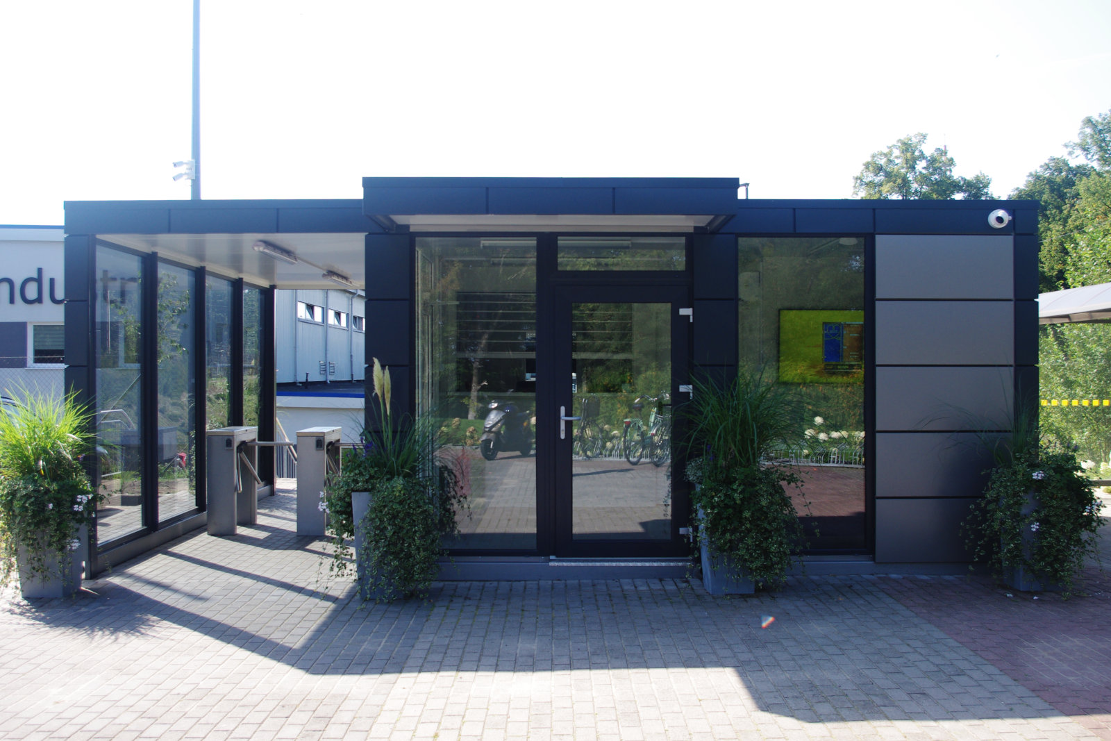 High-security modular checkpoint building High-security modular gatehouse or checkpoint building in an industrial or defence-style environment