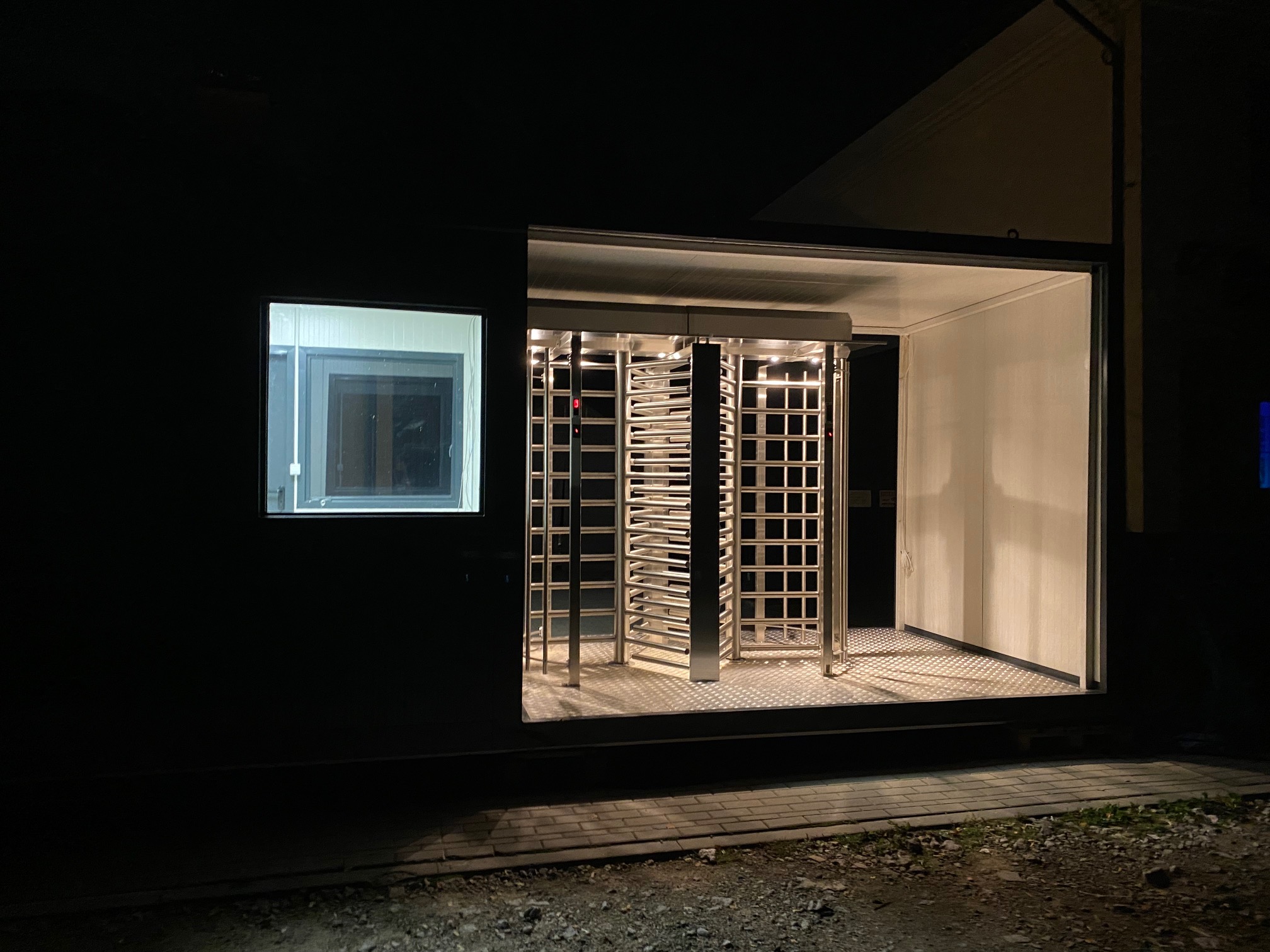 Security checkpoint building with turnstiles Modular security checkpoint building with turnstiles and illuminated access control point