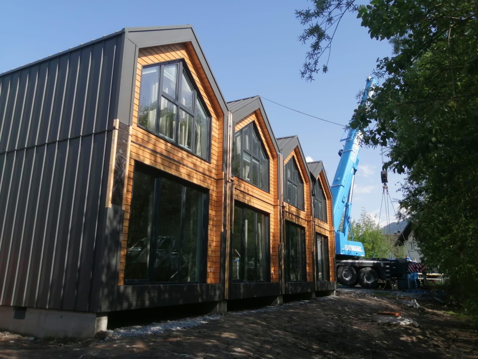 Modular construction project showing prefabricated building delivery and installation
