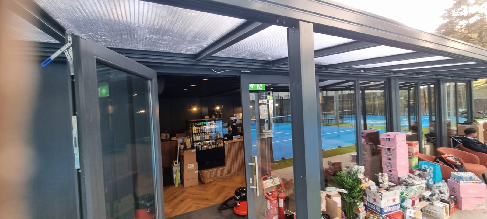ISO-frame modular clubhouse reception and pro shop at Pure Padel — KC Modular Buildings