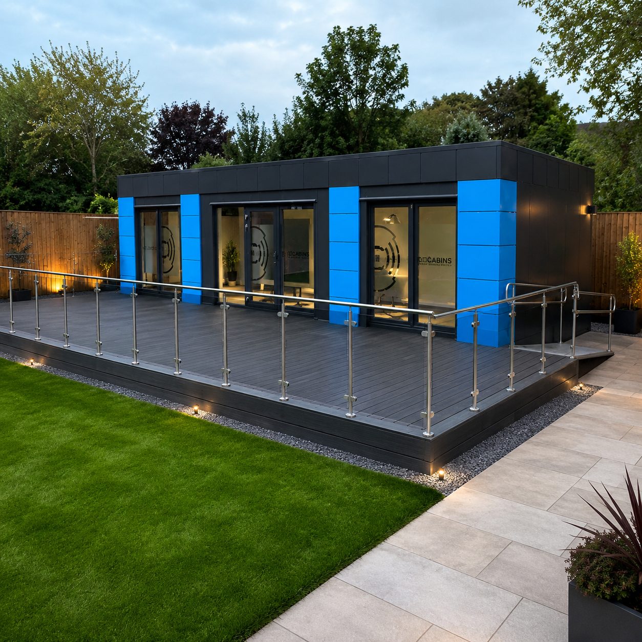 Residential-style modular garden room with large glazed doors in a premium UK garden