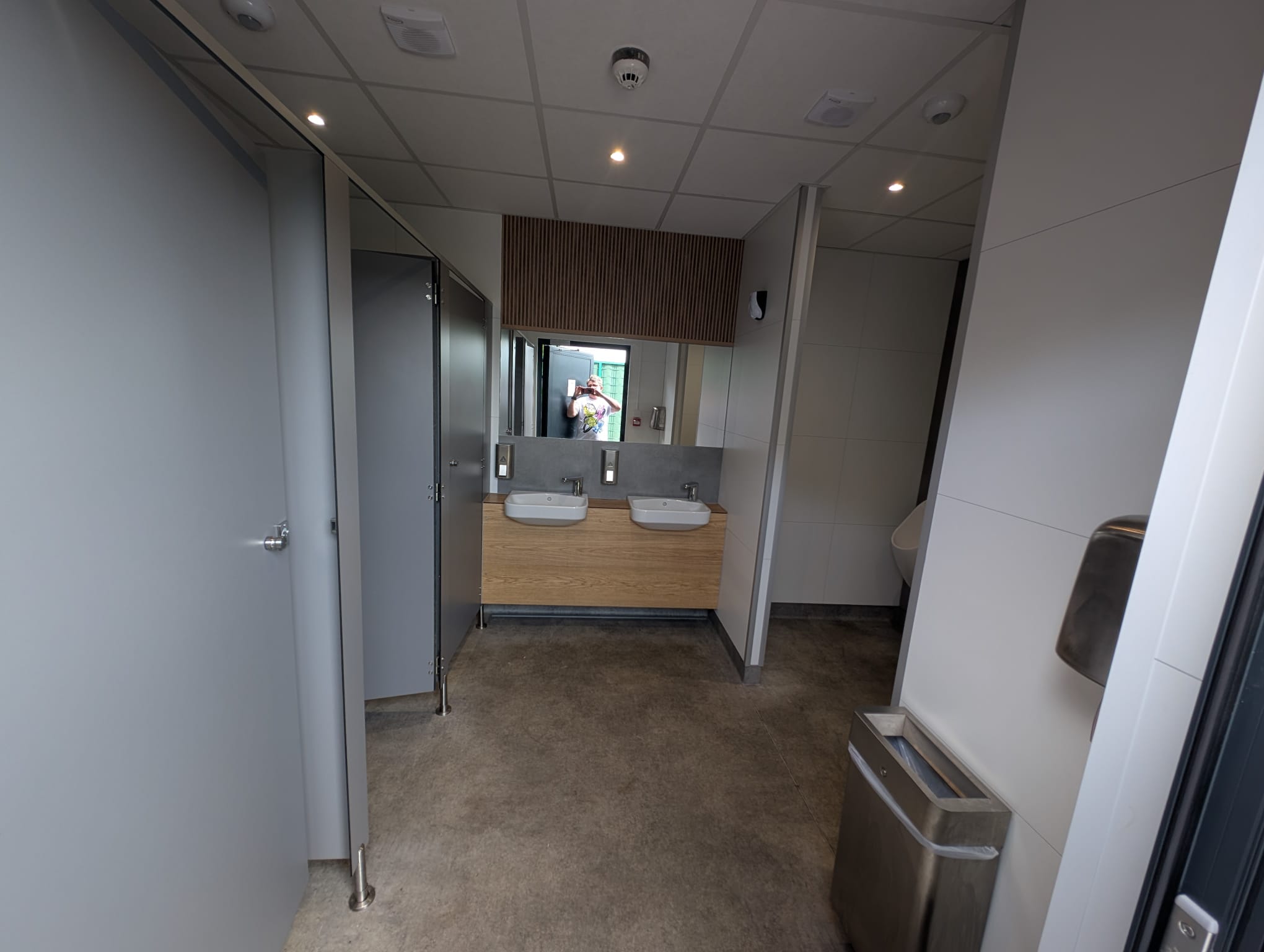 Toilet cubicles and twin basin area inside the modular welfare accommodation at St George’s Park.