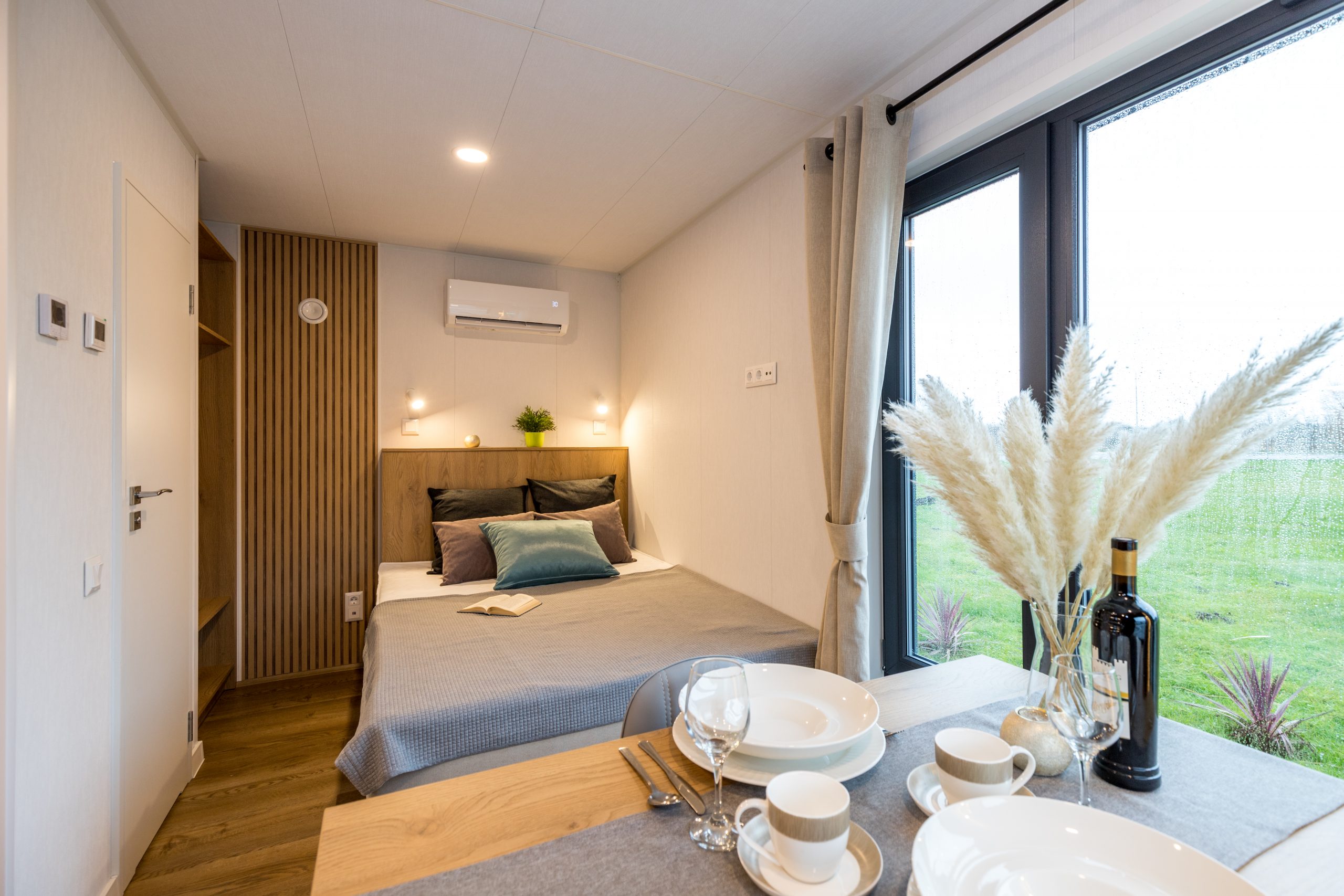 Scandinavian style garden pod interior with decorative wall panels and fitted furniture