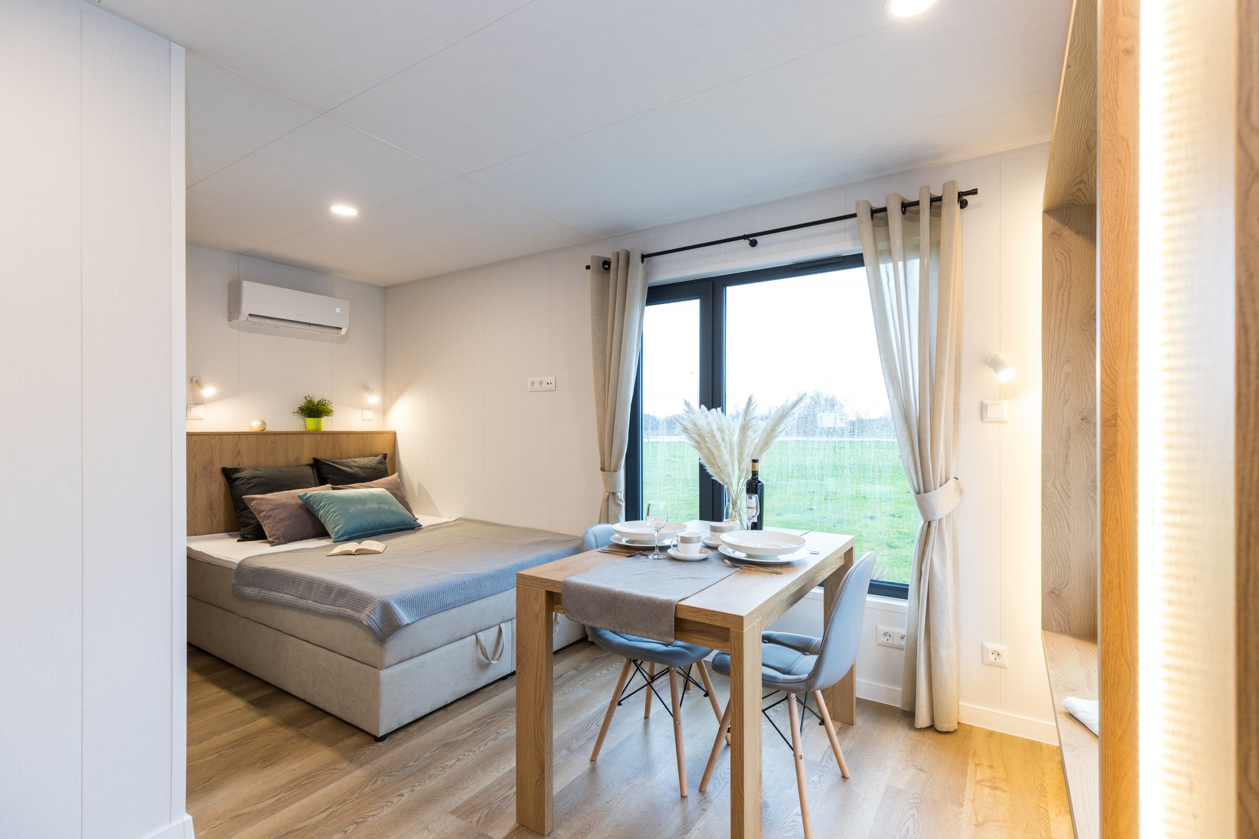 Garden pod bedroom with upholstered headboard, wardrobe and premium interior finish