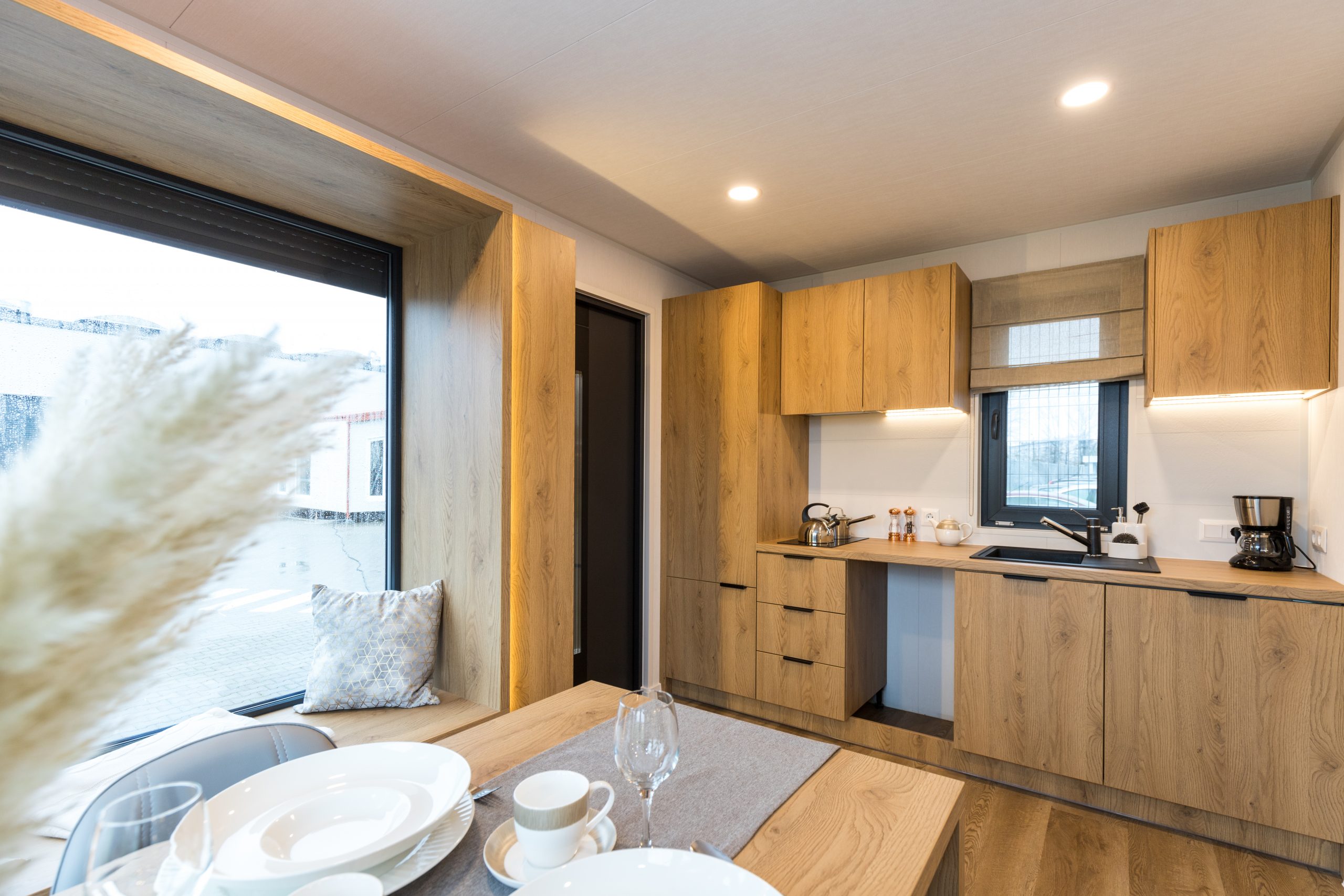 Premium garden pod interior showing kitchen, living area and fitted finishes