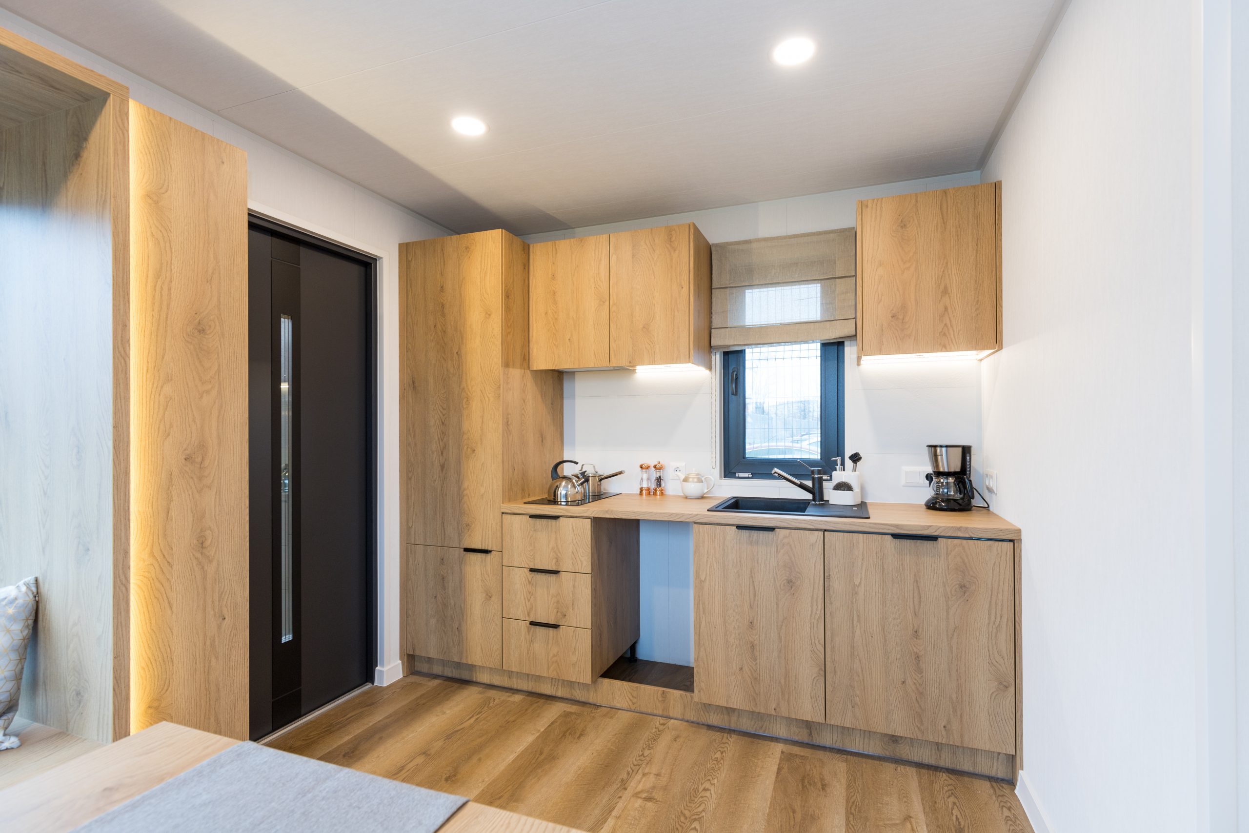 Garden pod interior detail with premium furniture, lighting and finished surfaces