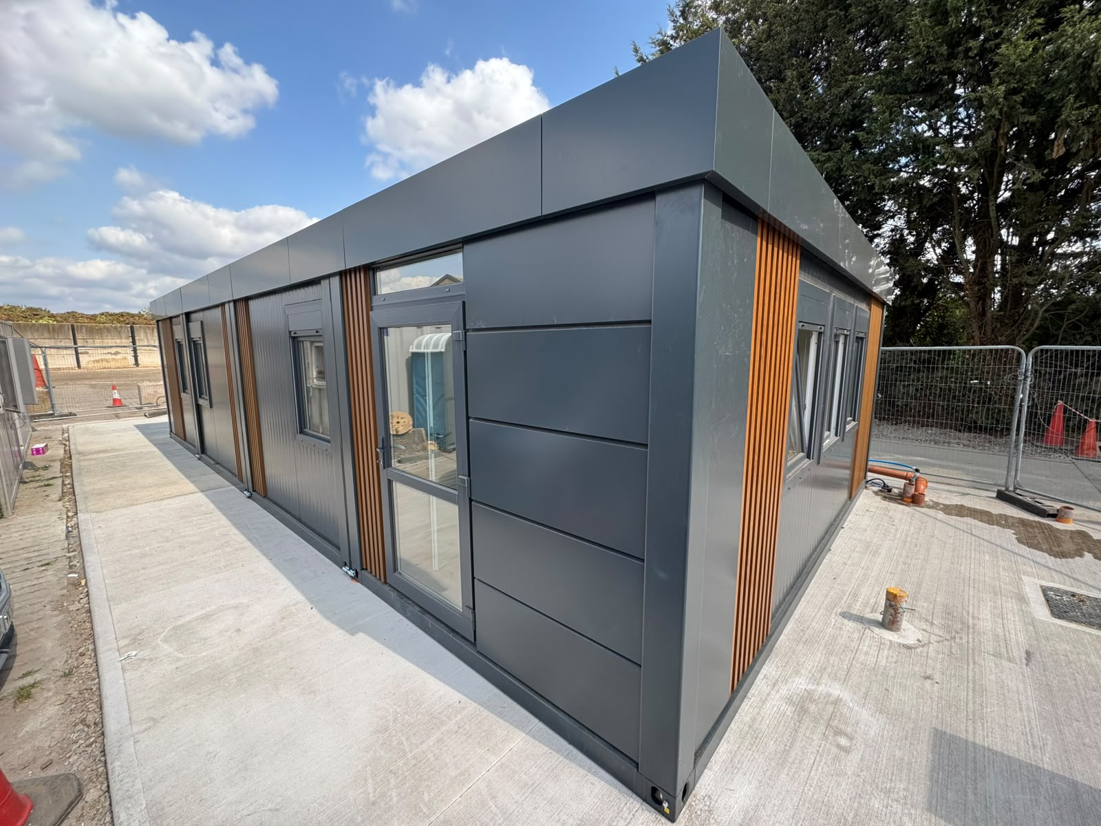 Commercial portable office building elevation with ISO frame modules joined on site