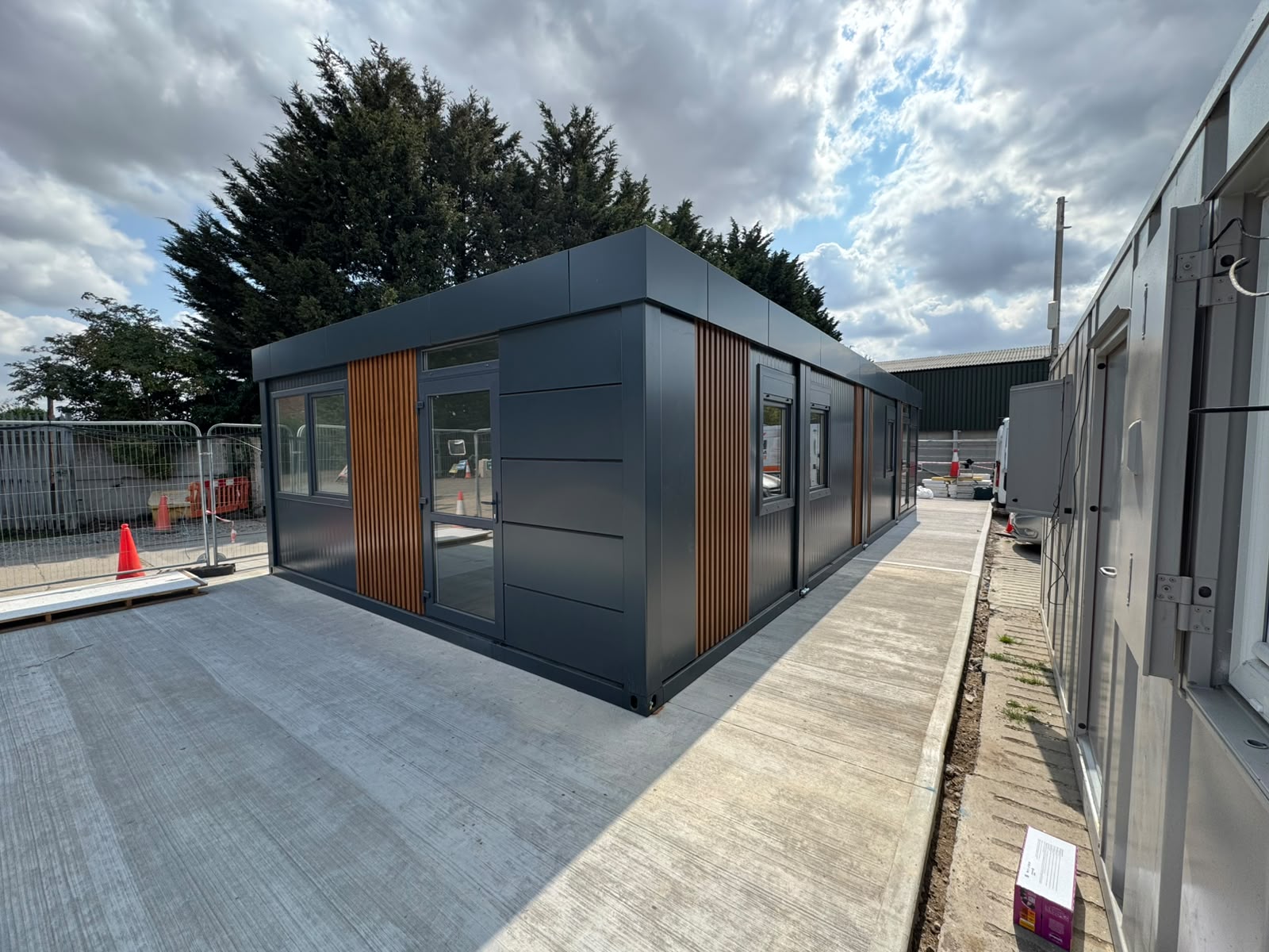 Portable modular building side view showing external cladding and glazing
