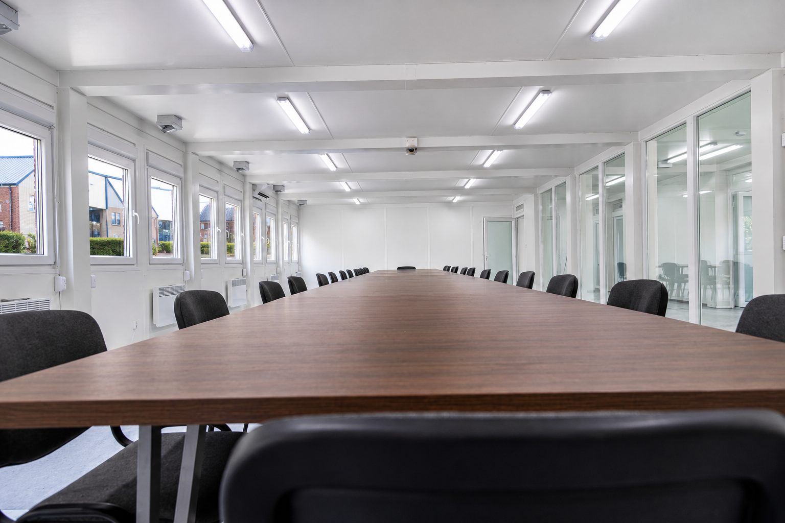 Modular committee room with formal seating layout and circulation space
