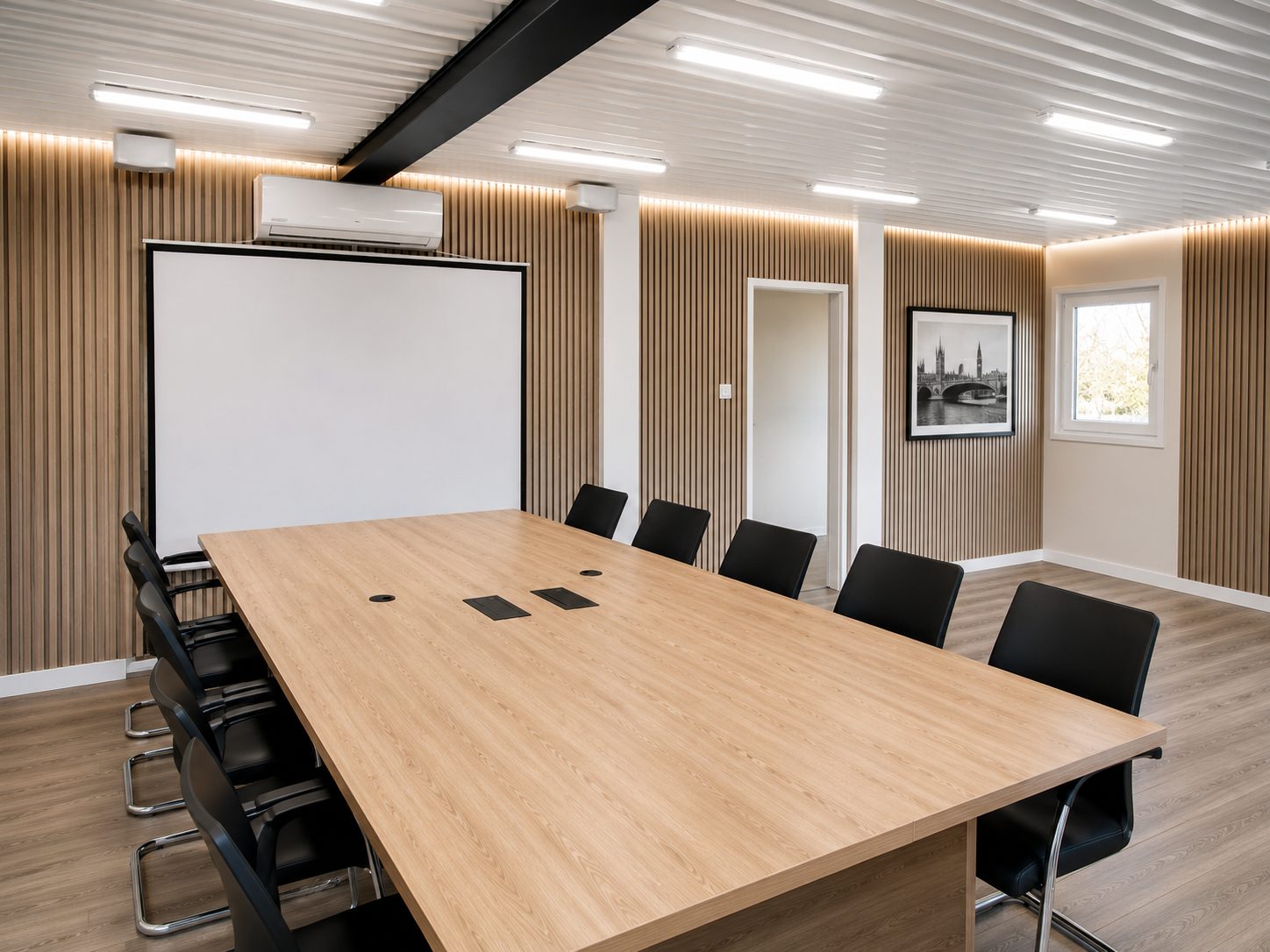 Modular boardroom with presentation wall and formal meeting table