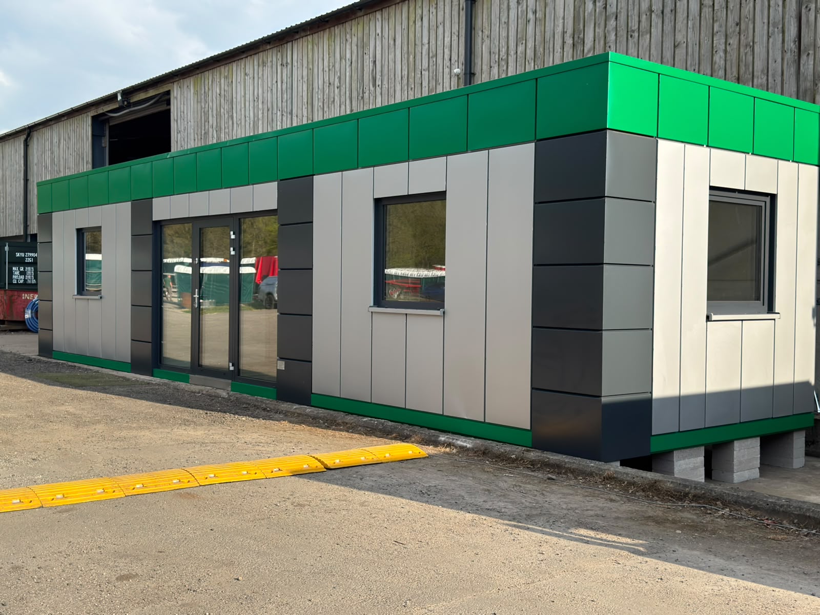 Front elevation of Excloosive Ltd air conditioned modular office with glazed entrance and office windows